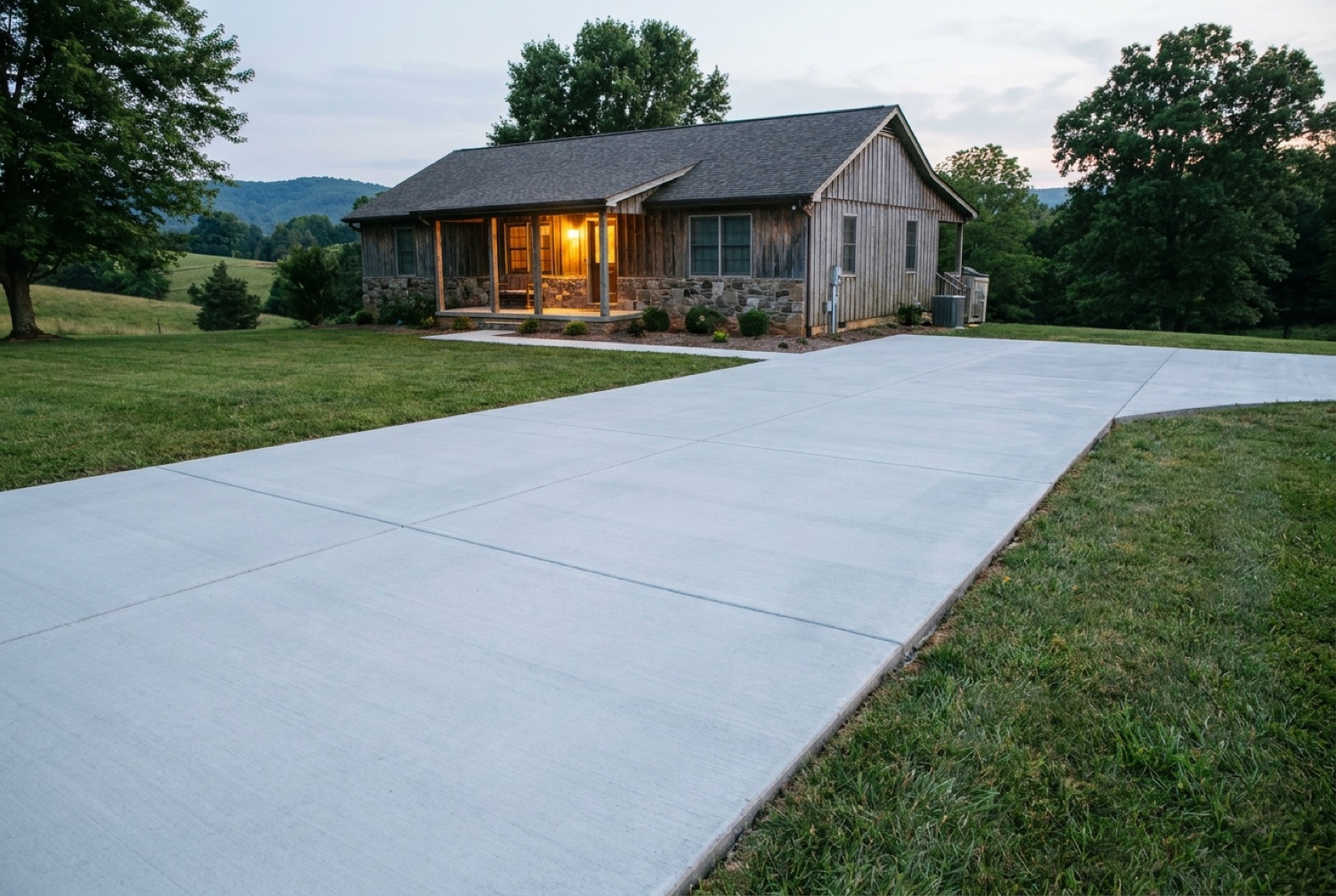 Brand-new smooth concrete driveway after replacement by Bowman Griffin