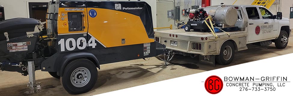Bowman-Griffin trailer-mounted line pump and branded truck at the shop